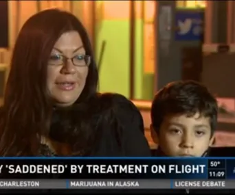 Woman and young boy appear in a news segment about their treatment on a flight.