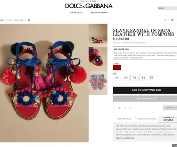 Dolce & Gabbana sandals with colorful pompoms and decorations, labeled "Slave Sandal" priced at $2,395.