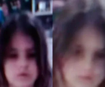 Blurry image of a young girl with long hair. Identity unknown. Police seeking assistance in locating her.