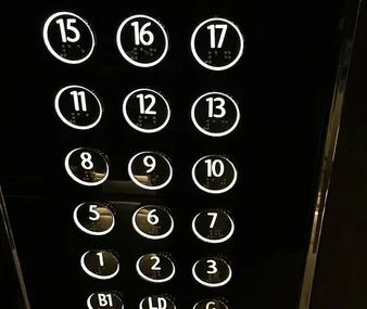 "Elevator buttons showing floors 1-17, skipping 4 and 14, due to Chinese superstition about numbers."