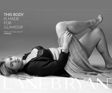 Plus-size model in lingerie and jacket, lying down with raised leg, text: "This body is made for glamour."
