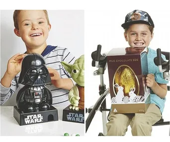 Boys smiling with Star Wars toys and a large chocolate egg, one using a walker.