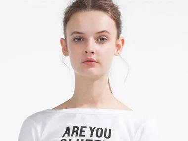 Model wearing a white Zara t-shirt with the text "Are you gluten-free?"