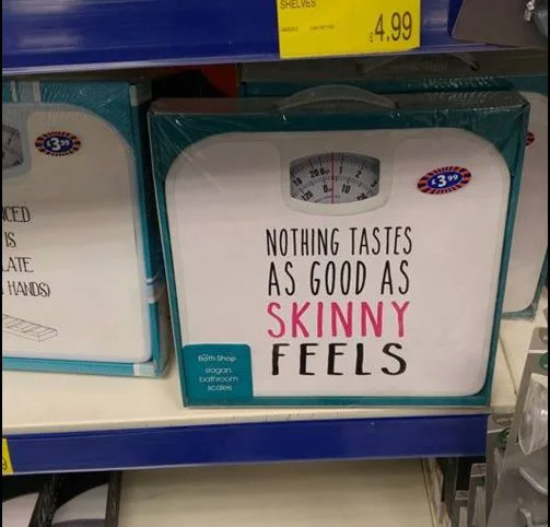 Bathroom scales on store shelf with the phrase "Nothing tastes as good as skinny feels" printed on them.