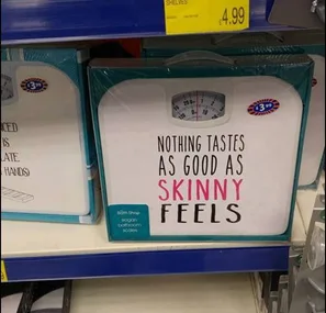 Bathroom scales on store shelf with the phrase "Nothing tastes as good as skinny feels" printed on them.