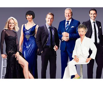 Celebrities dressed in formal attire posing against a gray background.