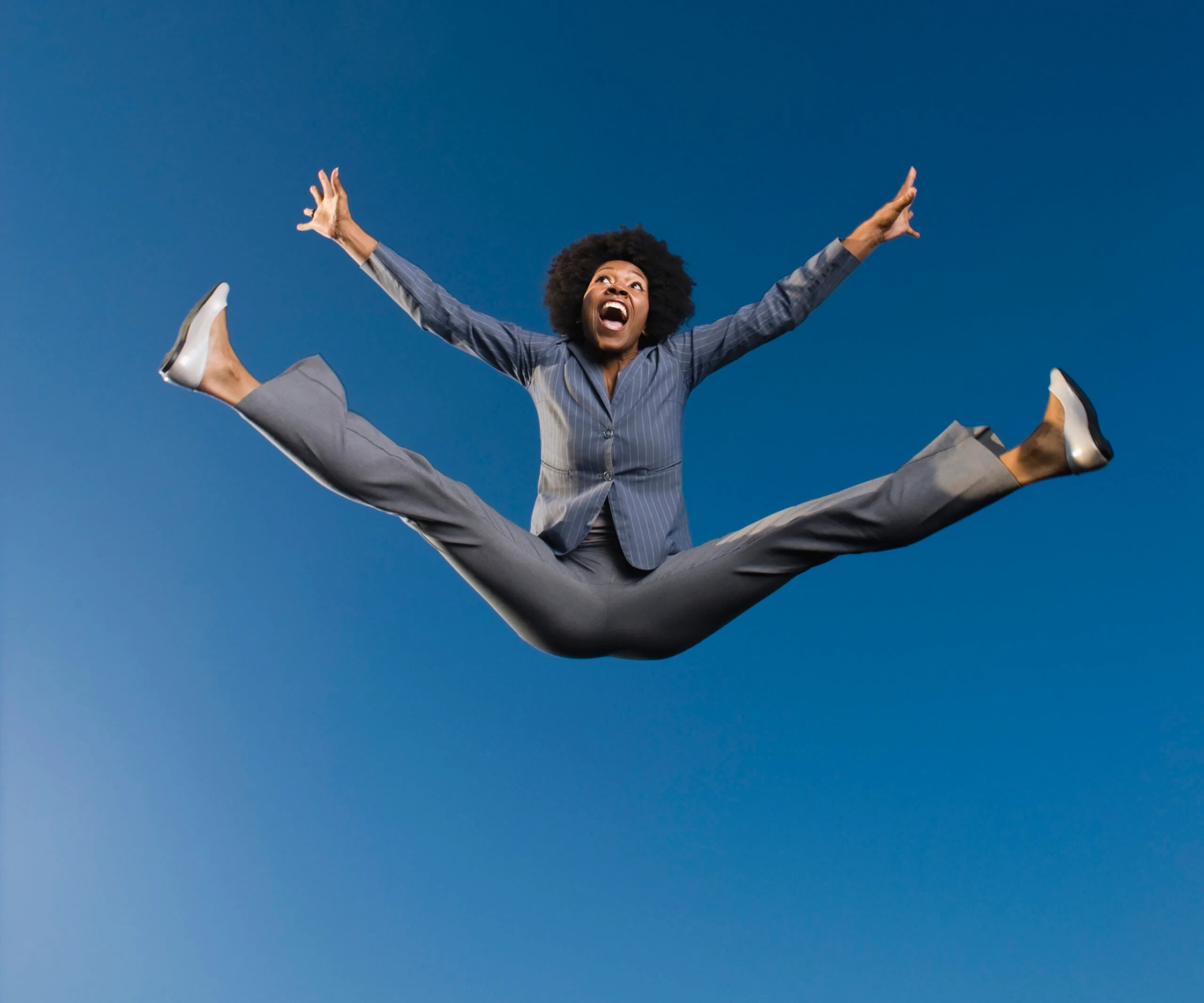 happy woman jumping in air