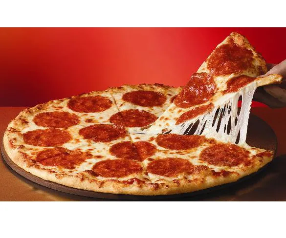 A pepperoni pizza with one slice being lifted, showcasing melted cheese stretch, set against a red background.