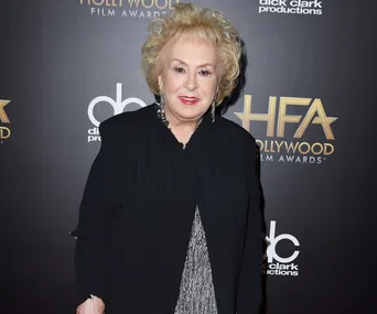 Doris Roberts attends the Hollywood Film Awards in a black outfit, smiling at the camera.