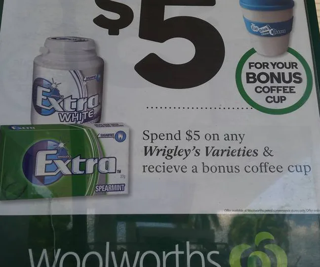 "$5 offer for Wrigley's Extra gum with typo 'recieve' instead of 'receive' at Woolworths, includes bonus coffee cup."