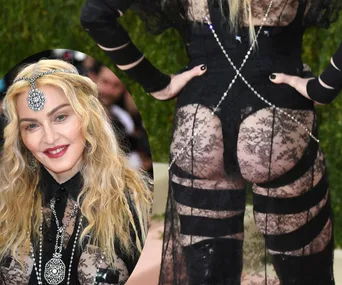 Madonna in a black lace outfit at the Met Gala, featuring a jeweled headpiece and an open back design.