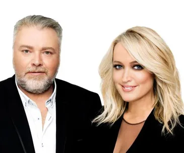 Radio hosts in formal attire, posing against a plain background.