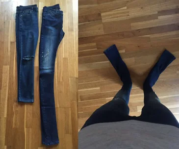 "Two pairs of jeans on floor; one worn with overly long legs extending awkwardly past feet."