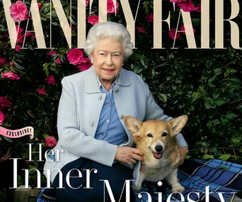 Elderly woman in a pale blue jacket with a corgi, sitting in a garden with pink flowers, on a magazine cover.