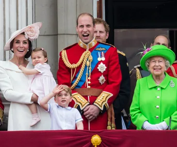 Royal family members on a balcony during Trooping the Colour 2016, smiling and waving.