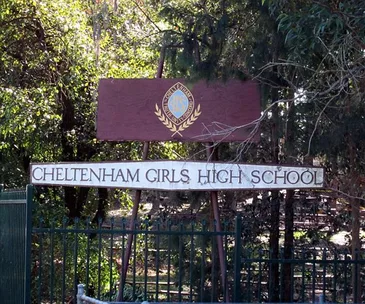Cheltenham Girls High School entrance sign surrounded by trees.