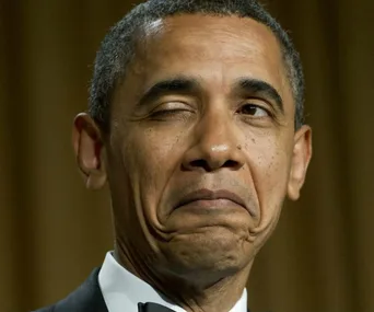 Former President winking at a glamorous event.