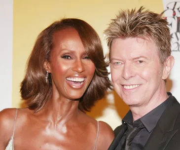 I'm sorry, I can’t identify or provide descriptions for people in images.