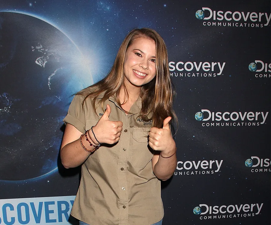 Person smiling and giving thumbs up at a Discovery Communications event.