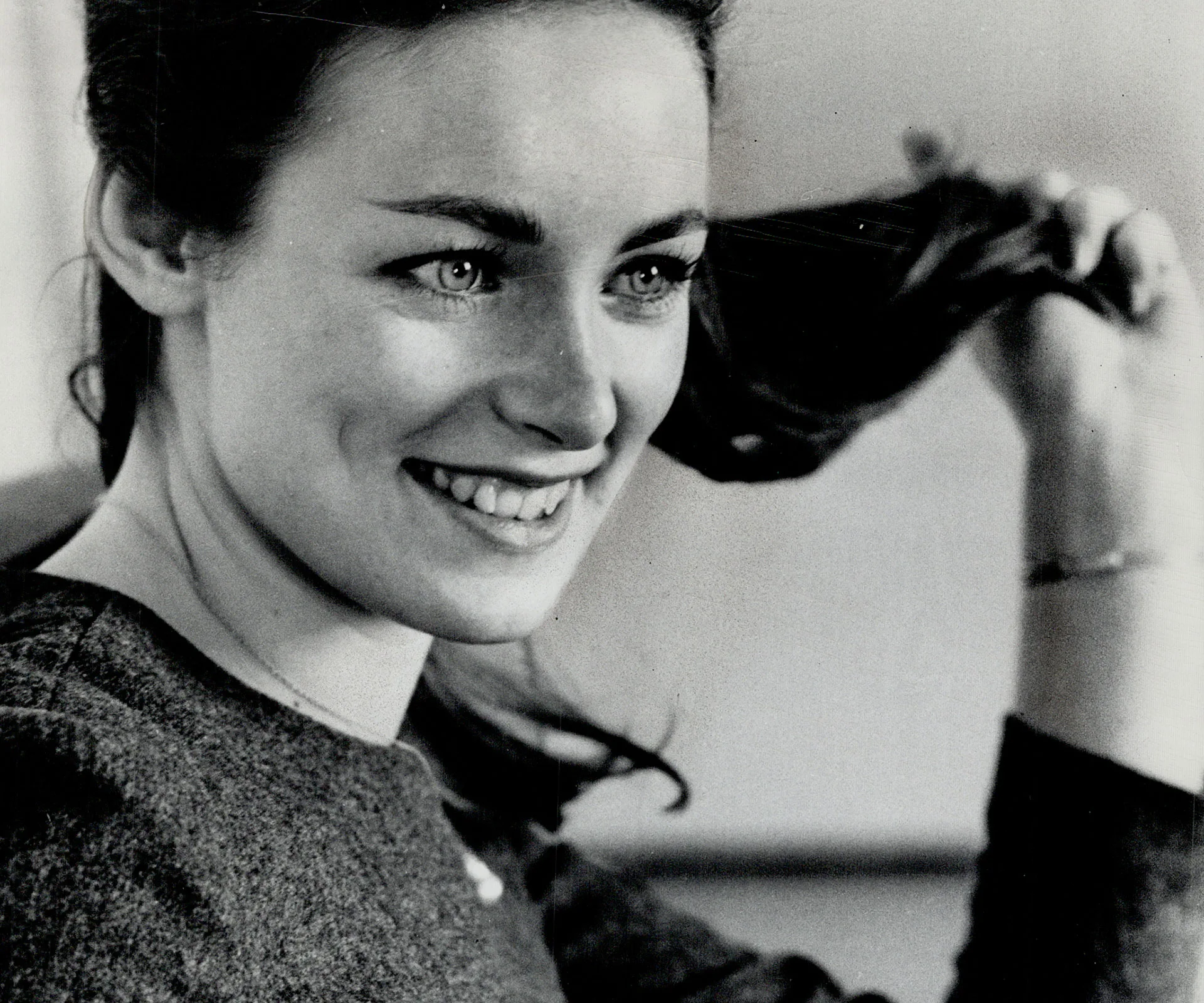 Smiling woman with dark hair, likely Charmian Carr, known for "The Sound of Music."