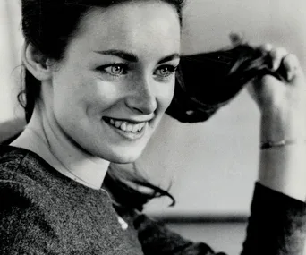 Smiling woman with dark hair, likely Charmian Carr, known for "The Sound of Music."