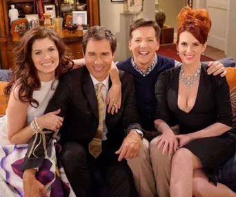 Cast of "Will & Grace" sitting on a couch, smiling, in a cozy living room setting.
