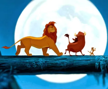 Simba, Timon, and Pumbaa walking on a log under a full moon in "The Lion King."