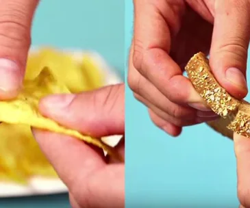 Hands reviving a stale tortilla chip and a piece of stale bread against a blue background.