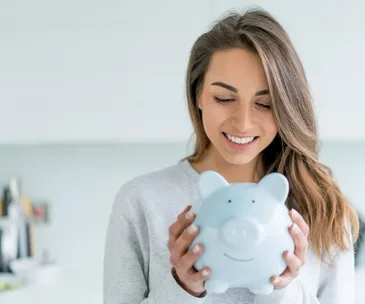 Woman saving money piggybank