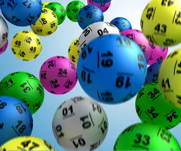 Colorful lottery balls with numbers, floating in space.