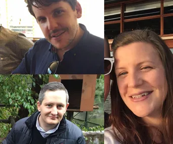 Group photo of two men and one woman outside, smiling.