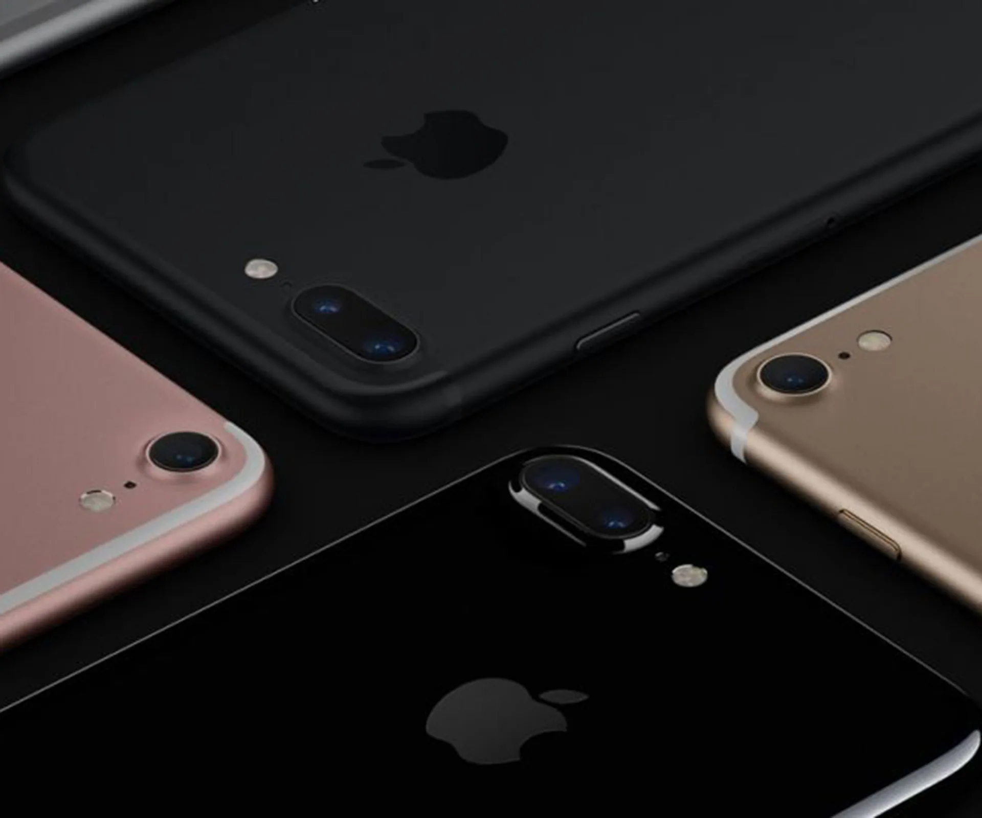 Various iPhone 7 models in different colors displayed on a dark background.
