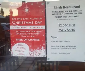 Poster for Shish Restaurant offering free Christmas meal for homeless and elderly, with date, time, and menu details.