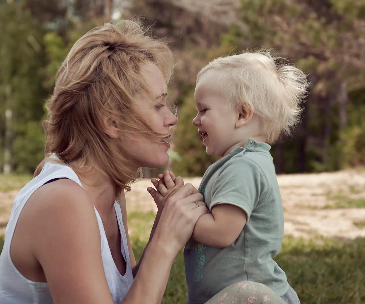 Baby smiling at mum