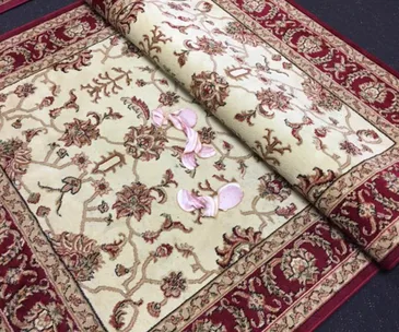 Prayer mats with floral design, bacon strips scattered on top.