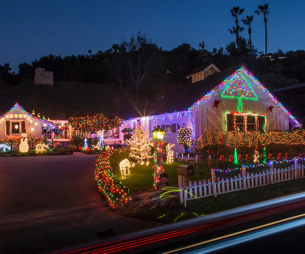 Child looking at Christmas lights