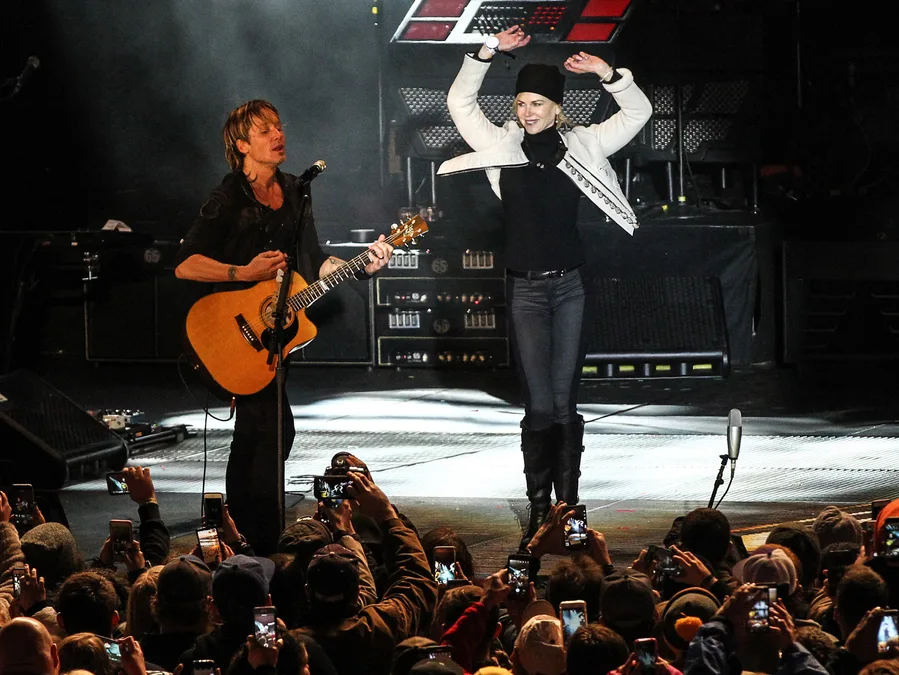 Nicole Kidman dancing along to Keith Urban at a CNN gig