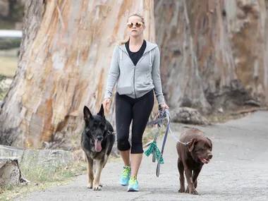 Reese Witherspoon walking with her dogs