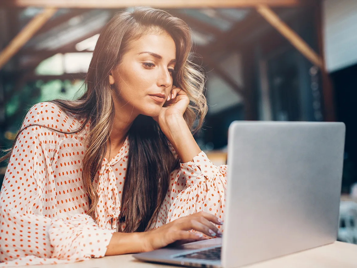woman googling computer cafe