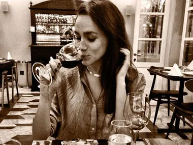 Meghan Markle drinking wine