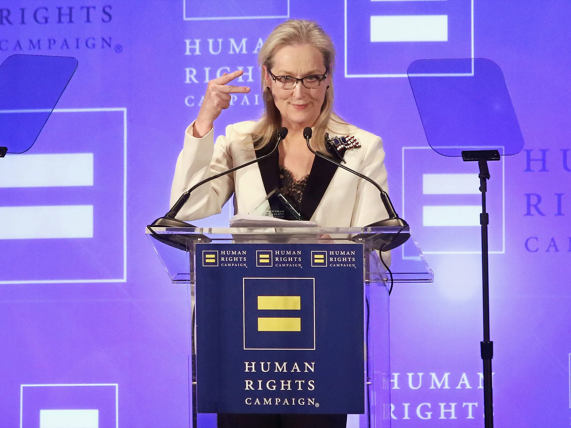 Meryl Streep speaks at a podium with "Human Rights Campaign" banner in a formal event setting.