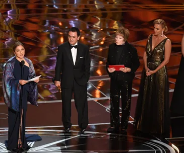 Speakers on stage at the Oscars 2017; Anousheh Ansari reading Asghar Farhadi's statement, standing with others.