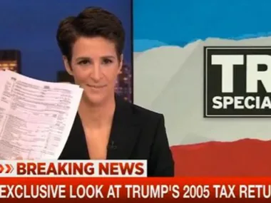 News anchor holding Trump's 2005 tax return on TV, headline reads "Exclusive Look at Trump's 2005 Tax Return."