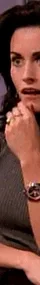 GIF of a surprised woman sitting on a chair, hand on chin, from a popular TV show.