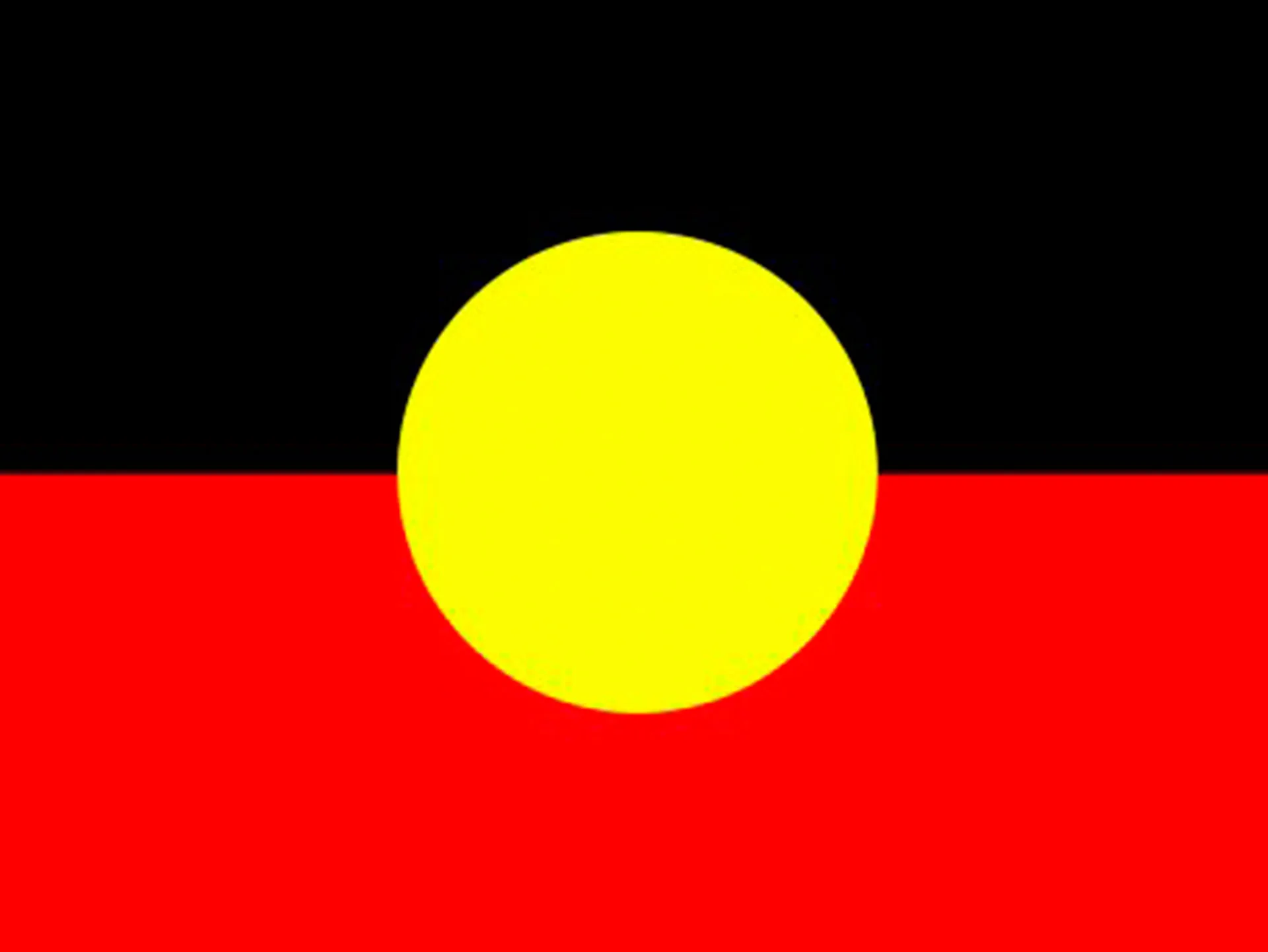 Flag of the Australian Aboriginal Peoples with black, red, and yellow circle.