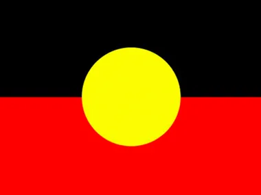 Flag of the Australian Aboriginal Peoples with black, red, and yellow circle.