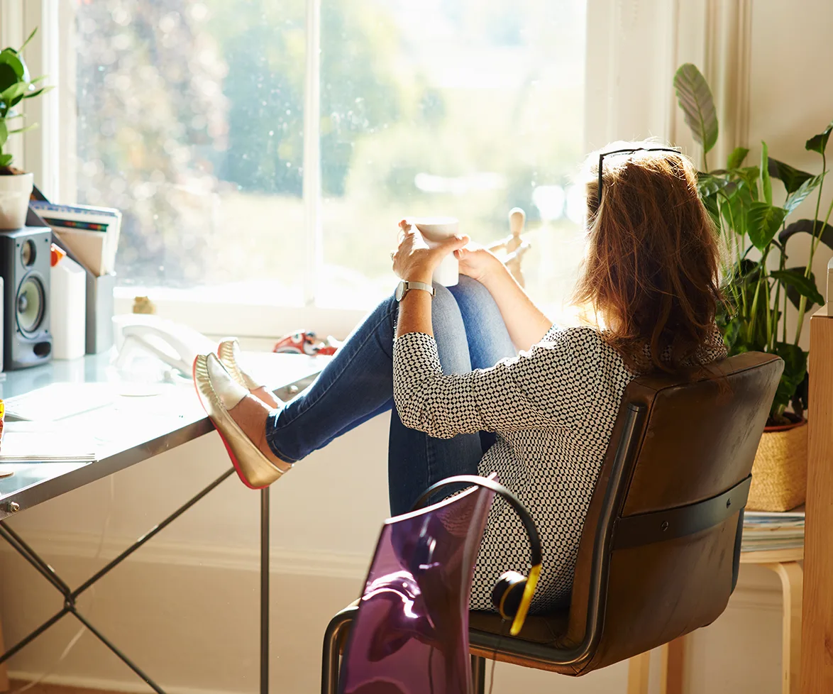 Woman staring out of window