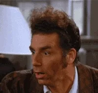 A surprised character from "Seinfeld" reacting with wide eyes and open mouth.