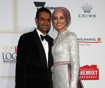 Elegant couple attending the 59th Logie Awards red carpet event, smiling and posing for photos.