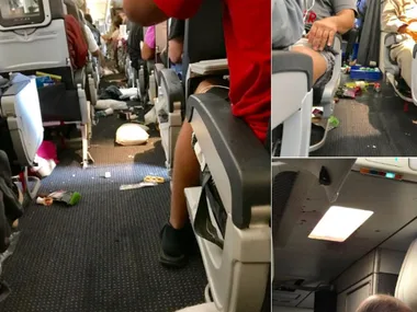 Airplane cabin showing scattered belongings and debris after severe turbulence. Passengers appear shaken.